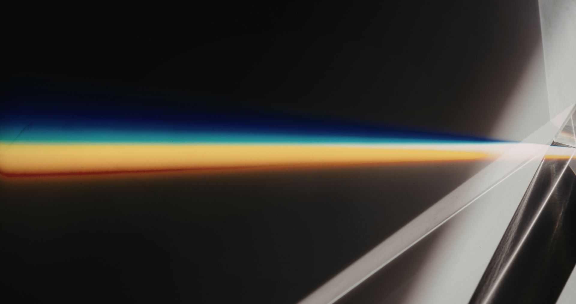 Abstract light converging into one bright line. Where Focus Goes Energy Flows.